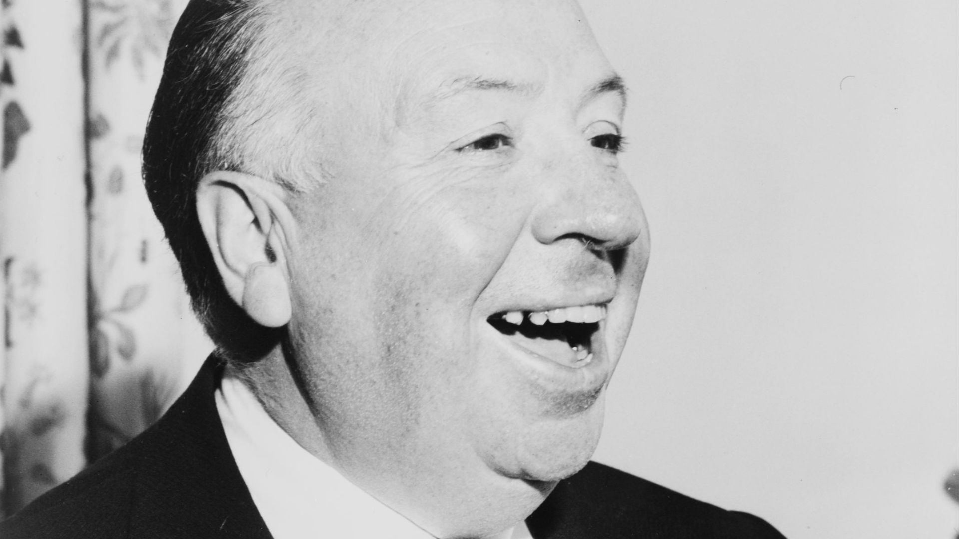 Alfred Hitchcock, head-and-shoulders portrait, facing right
