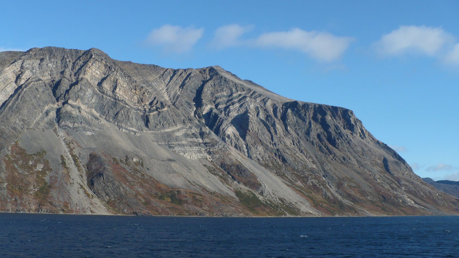 Near mouth of Saglek Fjord, Torngat Mountains National Park Reserve, Labrador, Canada.
Extensive folding of rocks due to formation visible.