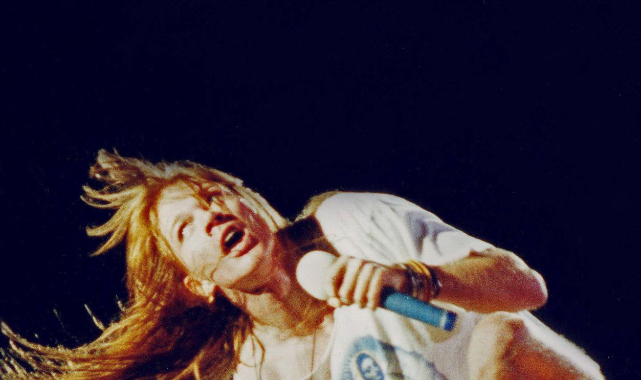 LONDON, UNITED KINGDOM - AUGUST 31: Axl Rose of Guns n' Roses performs on stage at Wembley Stadium on August 31st, 1991 in London, England.