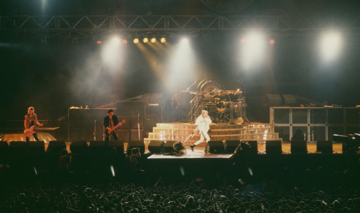 American rock group Guns N' Roses performing on stage at the at the Maracana stadium during the Rock in Rio II festival, Rio de Janeiro, Brazil, 18th- 27th January 1991. Left to right: Duff McKagan, Izzy Stradlin and Axl Rose.