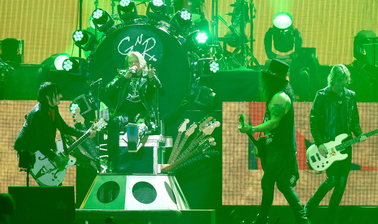 INDIO, CA - APRIL 16: (L-R) Axl Rose, Slash and Duff McKagan of Guns N' Roses perform onstage during day 2 of the 2016 Coachella Valley Music & Arts Festival Weekend 1 at the Empire Polo Club on April 16, 2016 in Indio, California.