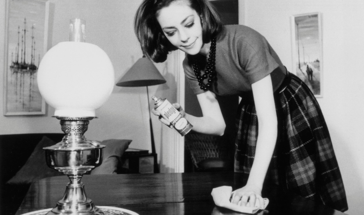 Woman polishing the living room table, 28 May 1963.