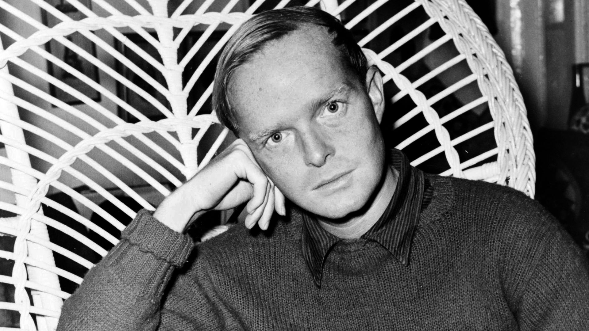 Truman Capote, half-length portrait, facing front, seated in a chair, resting head on his right hand, holding cigarette in his left hand / World Telegram & Sun photo by Roger Higgins.