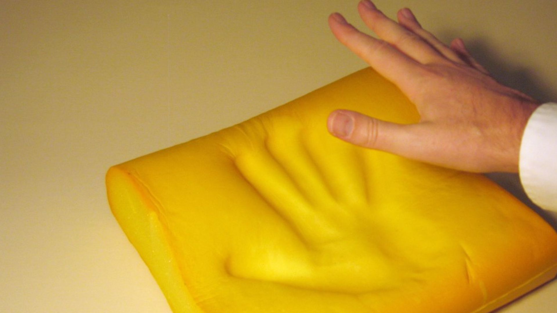 Memory foam. The picture is taken by pressing my hand in the foam and releasing it.