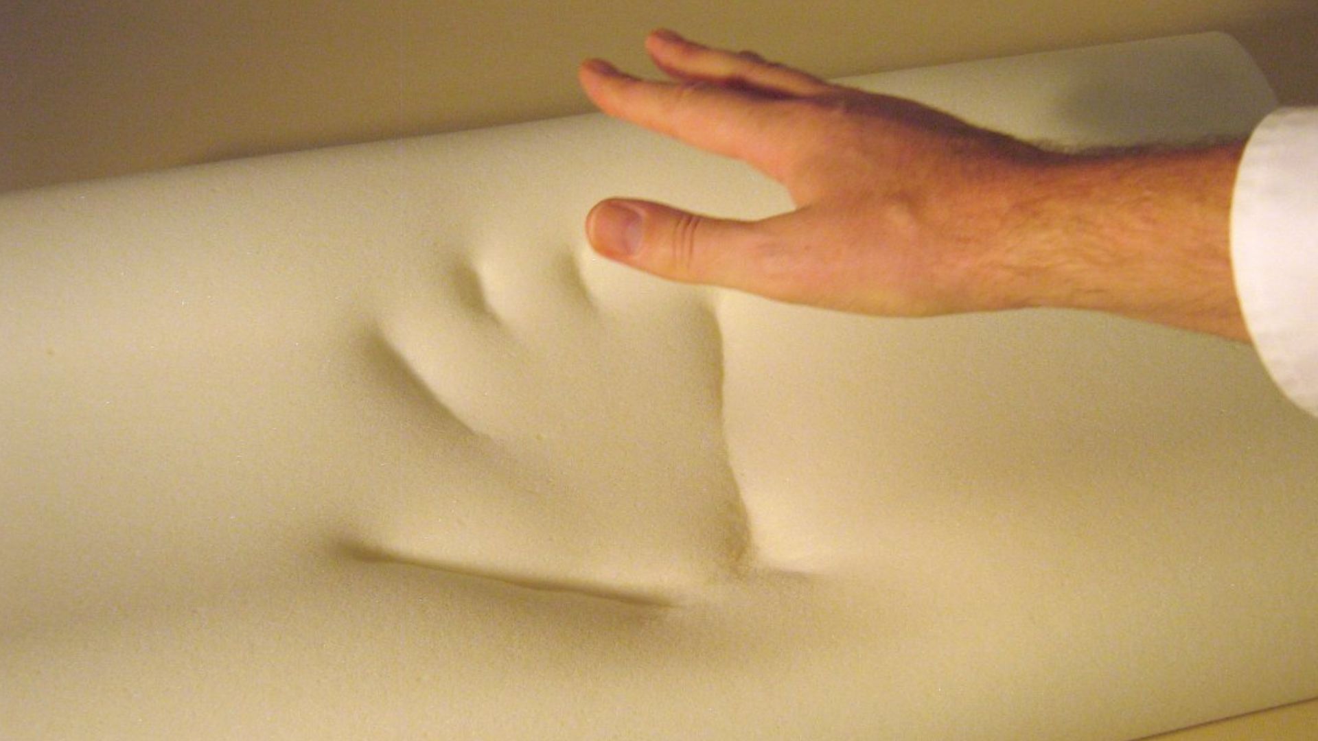 Memory foam. The picture is taken by pressing my hand in the foam and releasing it.