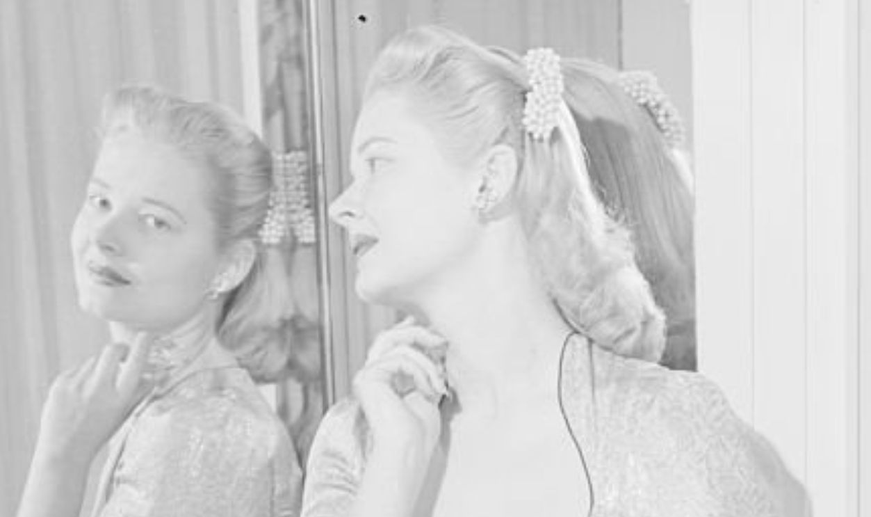 (Original Caption) Debutante-Showgirl. Now, here's a flashback to Lucy's sumptuous suite at the Ritz, showing the social-showgirl at her elegantly appointed dressing table.
