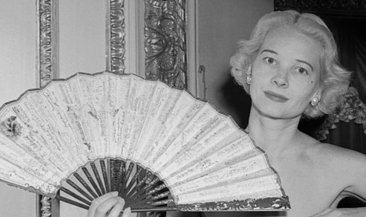 (Original Caption) Mrs. Winston F. C. Guest shows a fan autographed by 84 musical celebrities from Verdi to Toscanni, which she will carry at the Fan Ball on November 16. The ball is being held to benefit The Children's Memorial Cancer Fund, and will feature a variety of rare fans carried by New York Society matrons. Mrs. Sigismond Stojowski is the owner of the autographed fan shown.