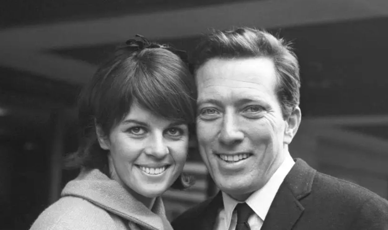 American singer Andy Williams and wife Claudine on their arrival at Heathrow Airport. They have travelled from Paris to attend the premiere of the film '55 Days at Peking'. Williams sang the theme tune in the new film.