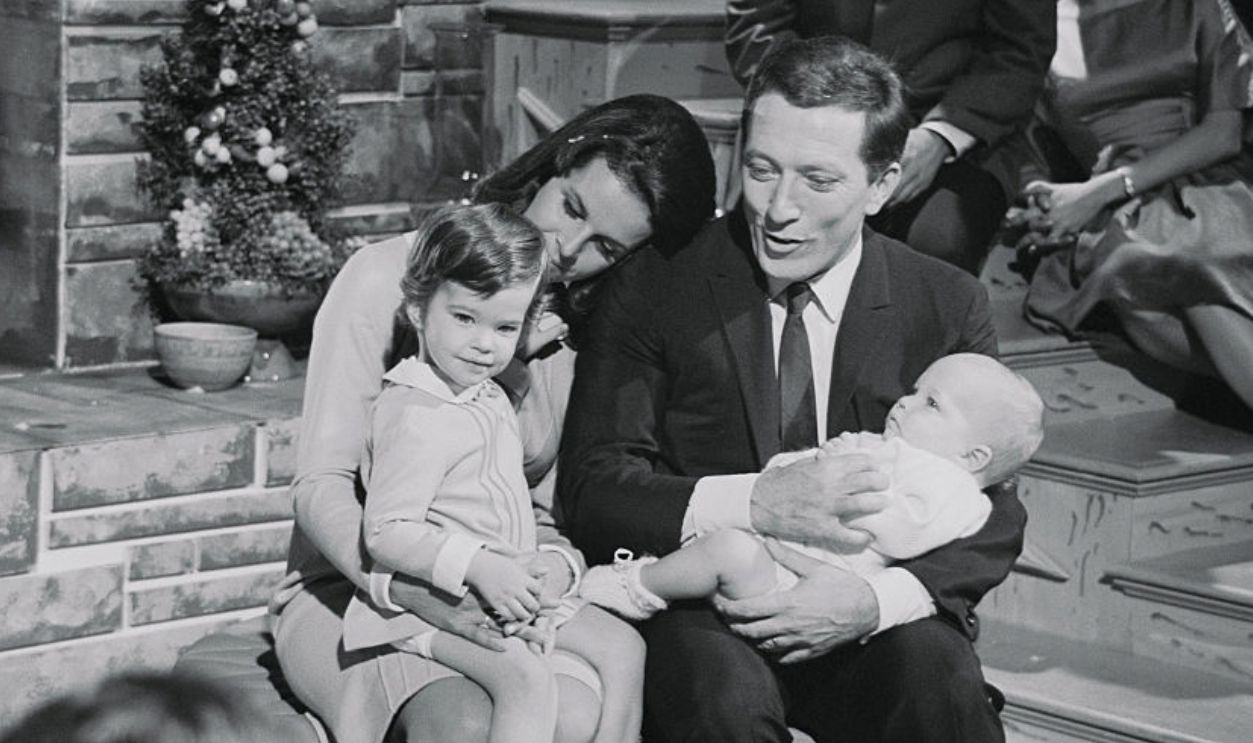 (Original Caption) Hollywood Story on Andy Williams. Hollywood, California: Of all the stars in movies and TV, the one you'd probably like the most to invite over for Christmas dinner is Andy Williams. Williams is shown here with his wife, Claudine Longet, and their two children, Noel, 2, and Christian, 8 months, during a taping of his Christmas show.