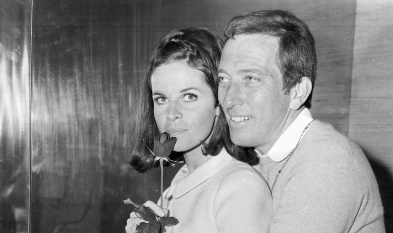 Singer Andy Williams holding a rose for his wife Claudine Longet at a press conference, 16th May 1968.