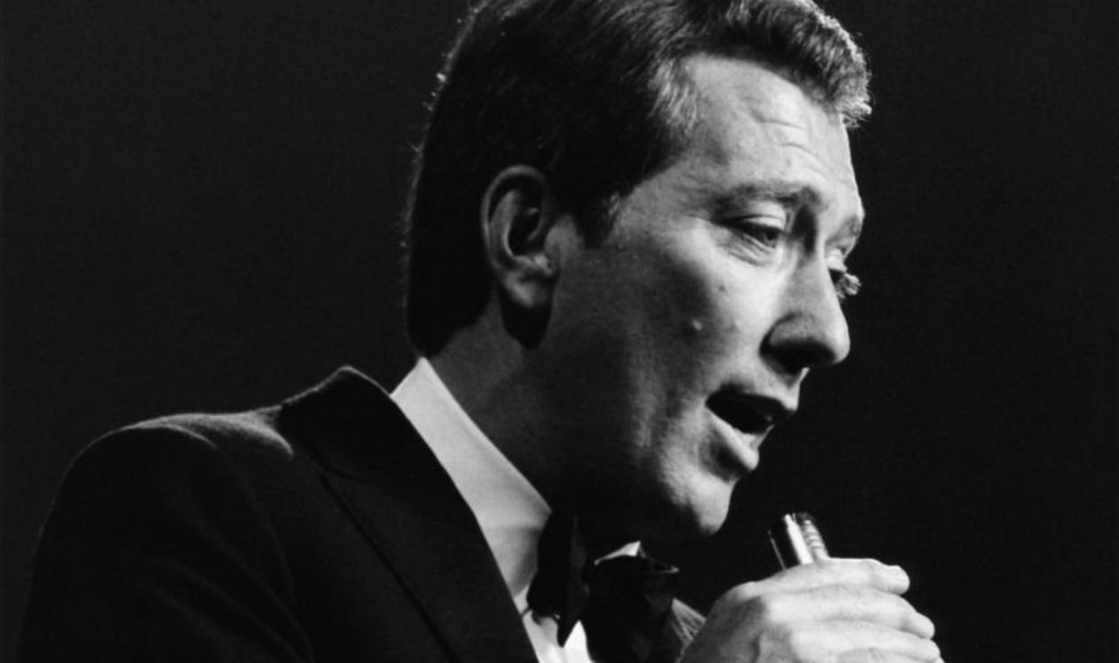 American singer Andy Williams (1927-2012) performs live on stage circa 1965.