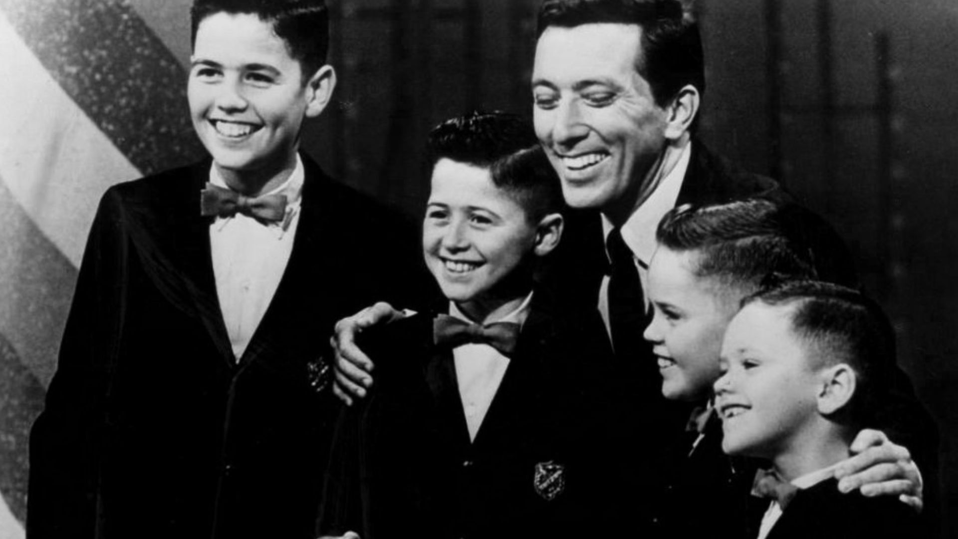 Publicity photo of the young Osmond Brothers with singer Andy Williams. The young boys were regulars on Williams' television show from 1962 to 1969. From left: Alan, Wayne, Andy Williams, Merrill, and Jay.