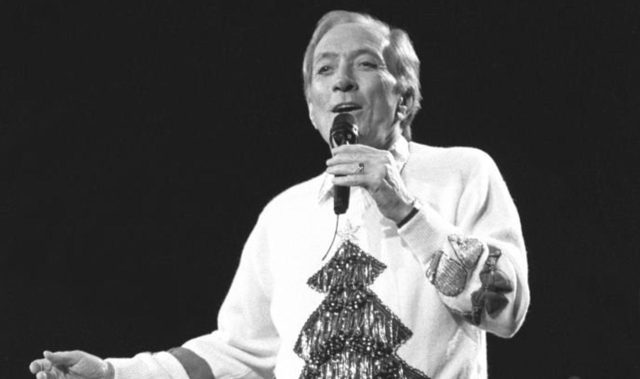 Singer Andy Williams, who has recorded 18 gold and three platinum certified albums, is shown performing on stage during a Christmas concert appearance on December 8, 1991.