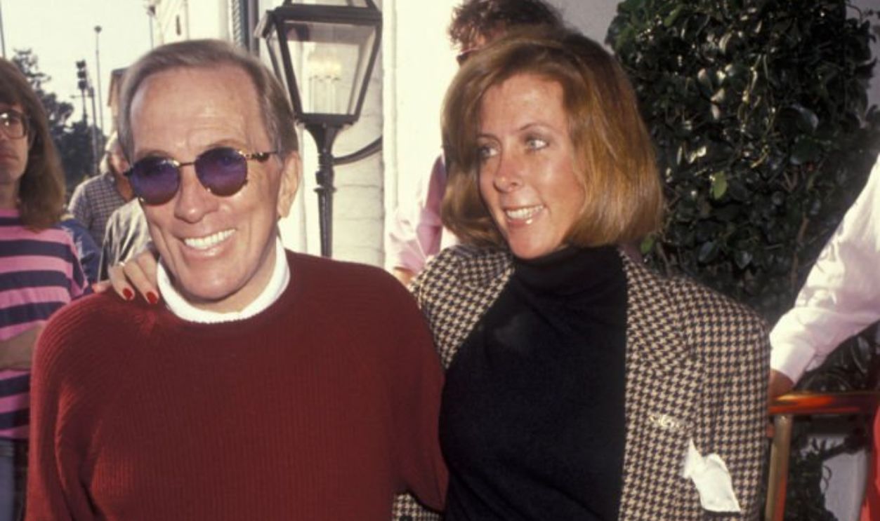 BEVERLY HILLS, CA - JANUARY 27: Singer Andy Williams and wife Debbie Haas attend Pierre Cossette Super Bowl Party on January 27, 1991 at Chasen's Restaurant in Beverly Hills, California.