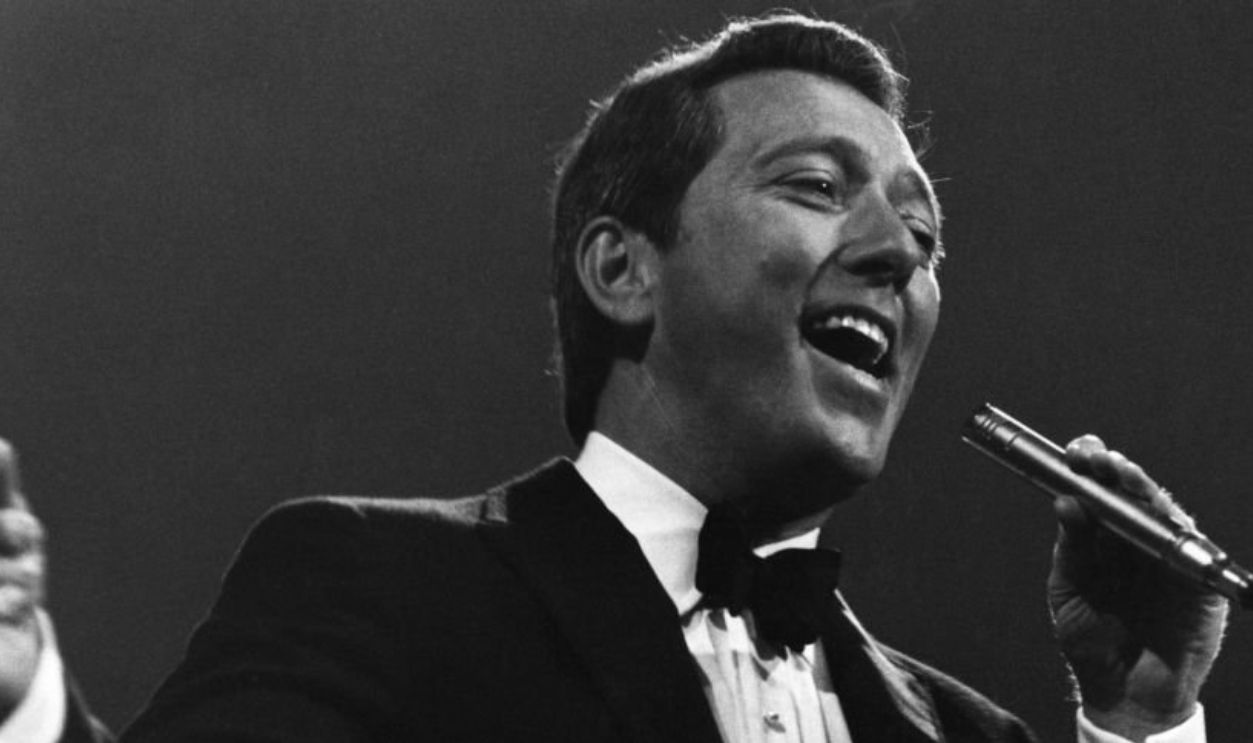American singer Andy Williams (1927-2012) performs live on stage circa 1965.