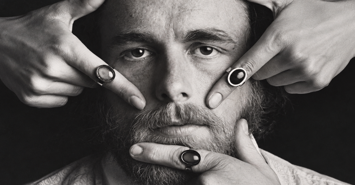 Josh Reynolds, the creator of mood stone rings, stroking his chin with his index finger, June 22, 1975, Lancaster, USA