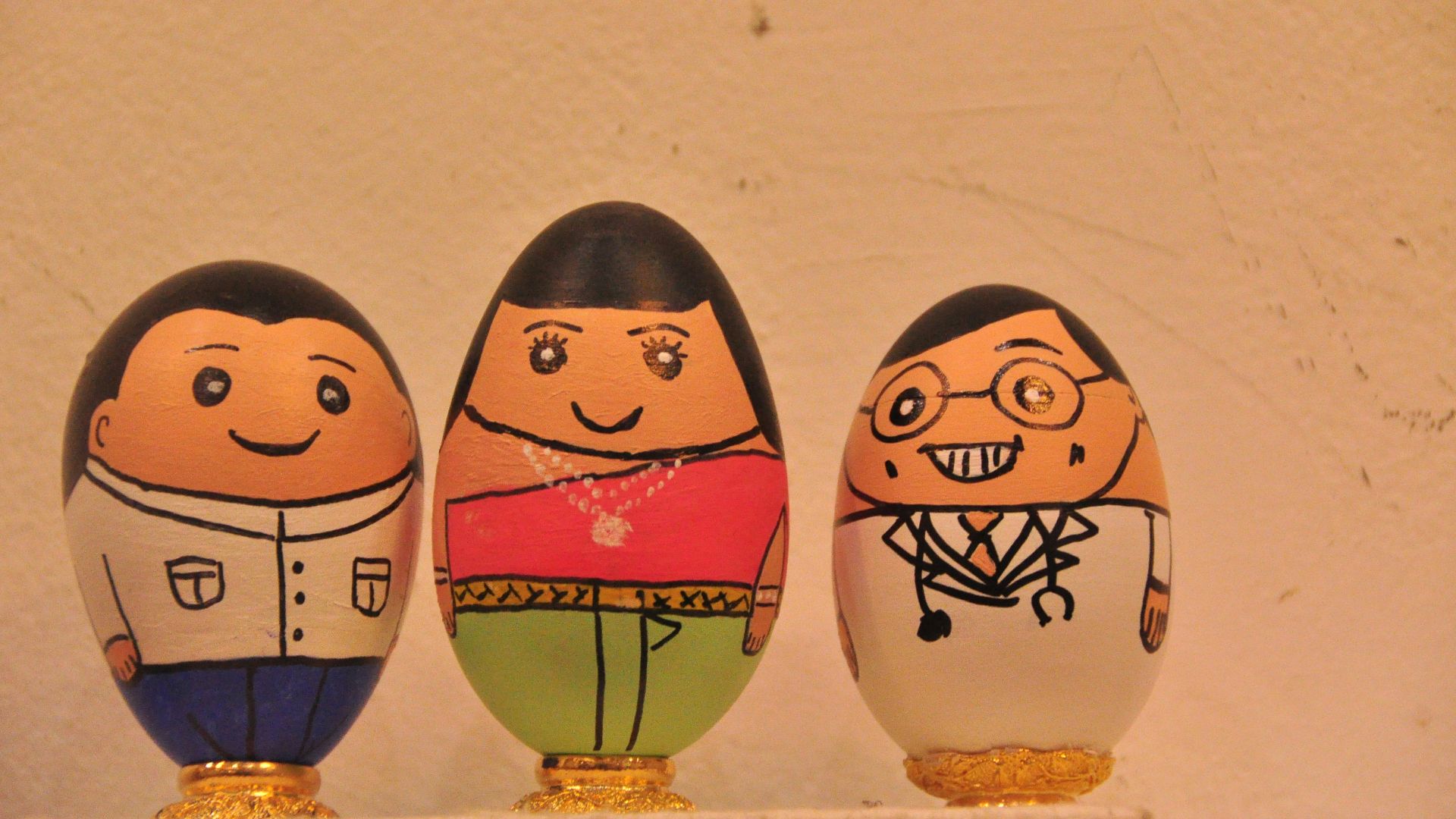 two brown and blue egg figurines