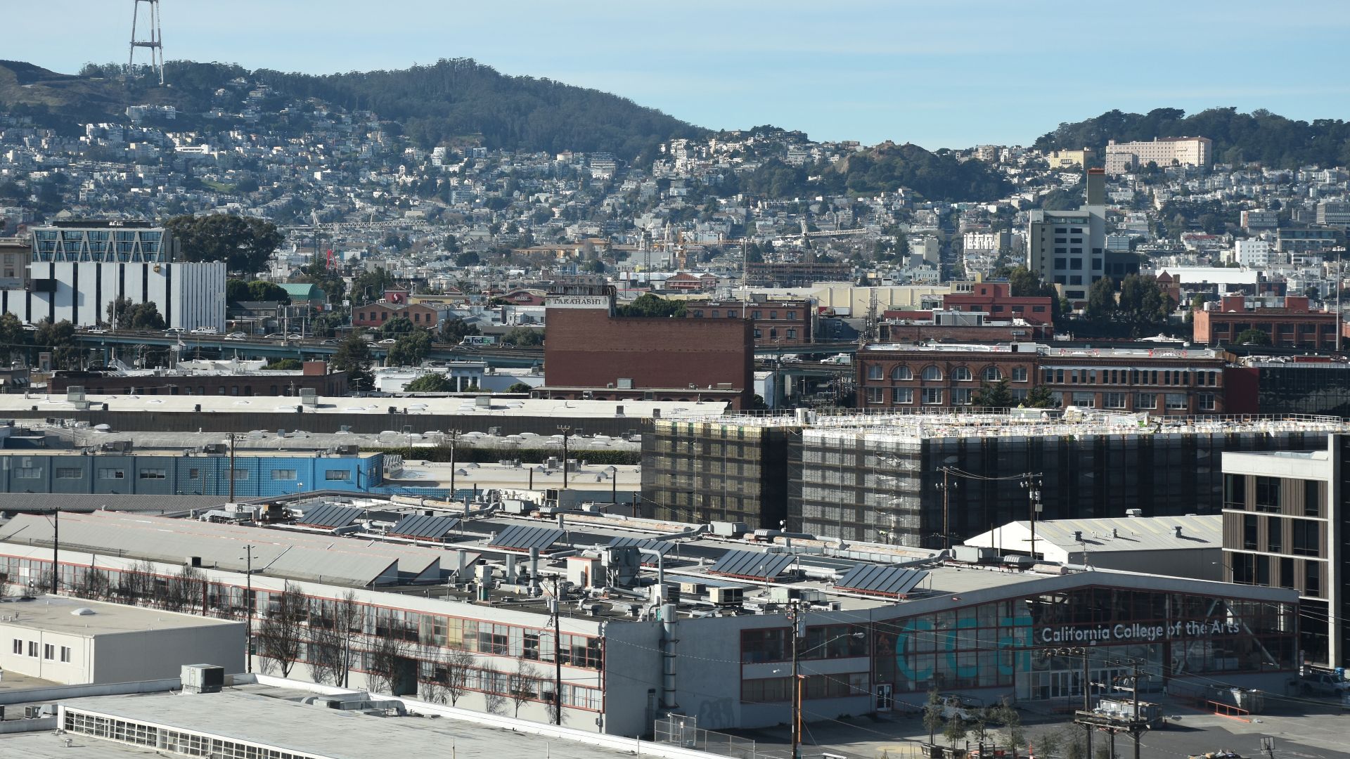 The California College of the Arts's campus in San Francisco's design district (in the foreground below, with Sutro tower in the background), seen from the Kaiser Permanente building at 1600 Owens Street