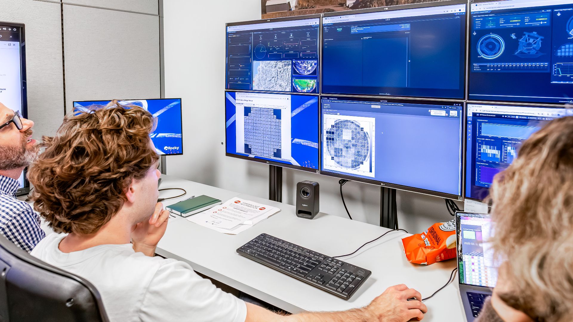 On 15 April 2025, SLAC’s Rubin Observatory operations and camera teams gathered in the Rubin control room at the Kavli Institute for Particle Astrophysics and Cosmology to witness the LSST Camera capture its first photons from the sky.