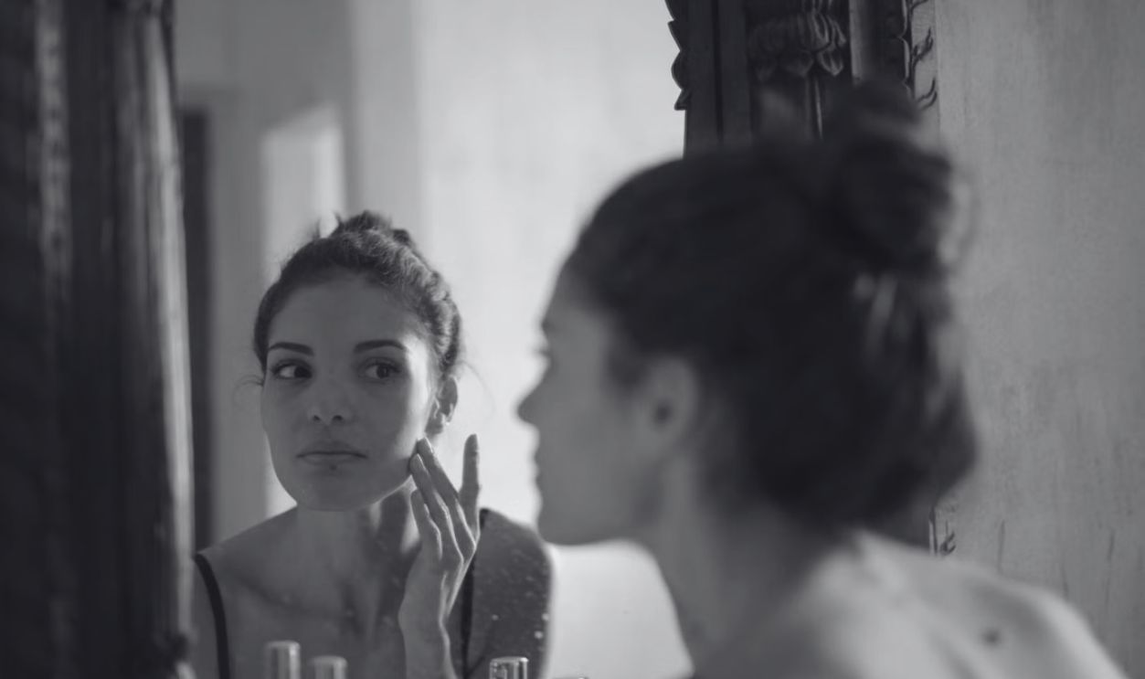woman checking on mirror