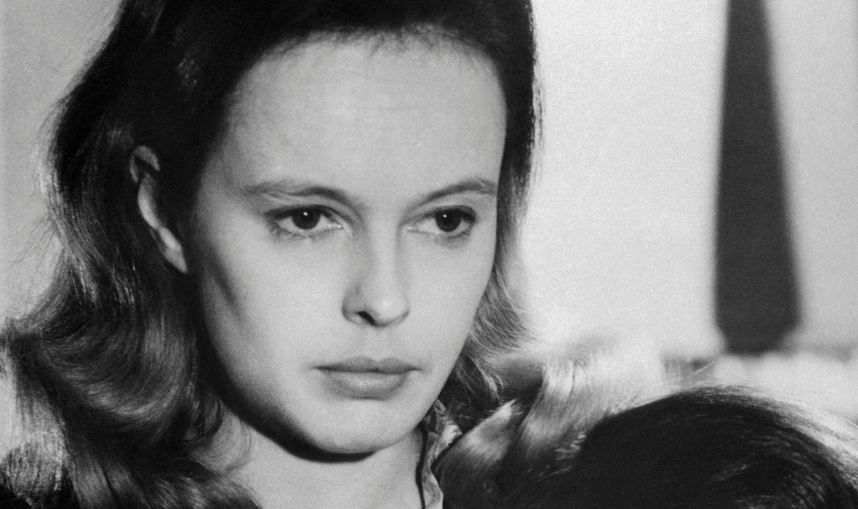 (Original Caption) Movie still of Sandy Dennis (blonde) and Anne Heywood in scenes from the 1968 film The Fox. On an isolated Canadian chicken farm, two young women struggle to make a retreat for themselves: the fragile sensitive Jill Banford (Sandy Dennis), who takes care of the cooking and the house, and the stridently self-sufficient Ellen March (Anne Heywood), known as "March," who does the heavy chores. March depressed by Bill's departure, is consoled by Jill. The young women drift back into their old ways, with March apparently reconciled to life on the farm, to Jill's relief and happiness.
