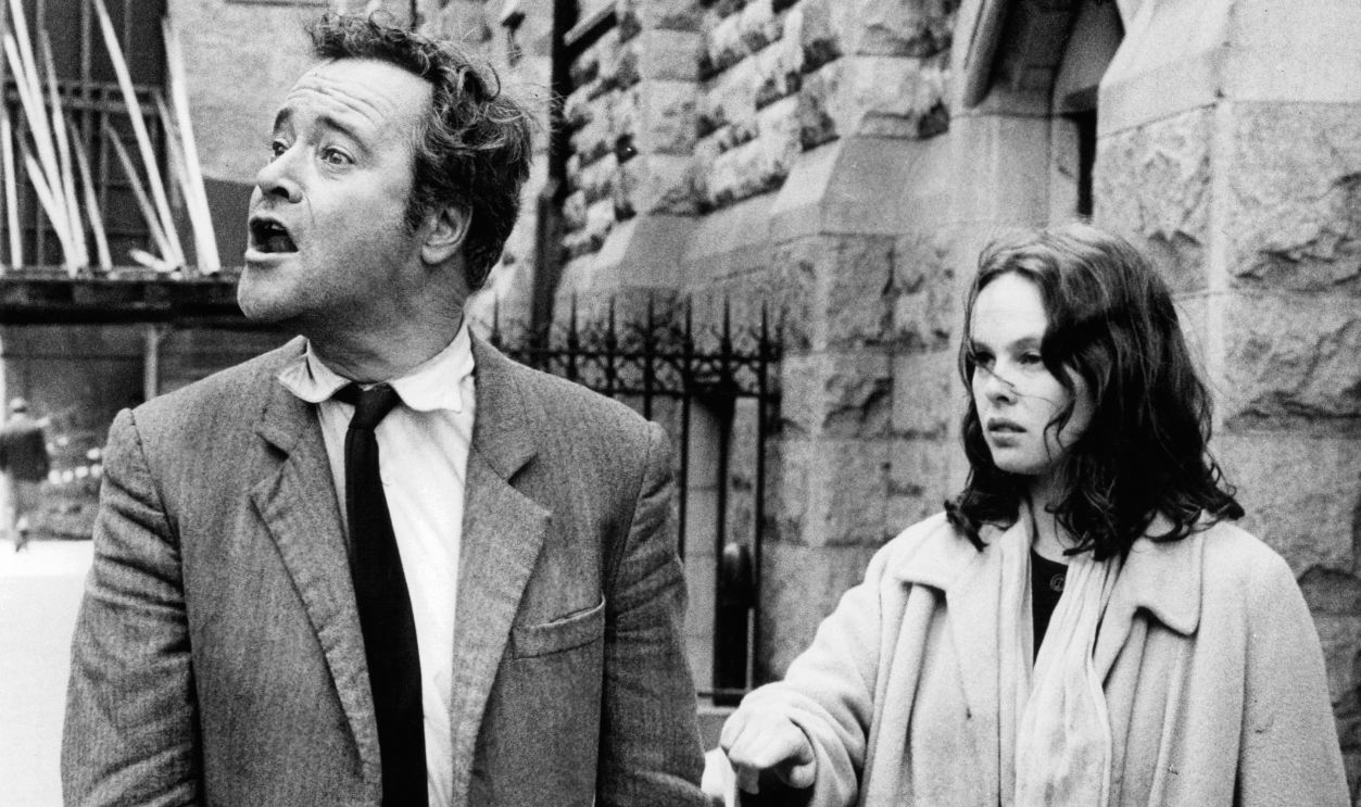 Jack Lemmon shouting out beside Sandy Dennis in a scene from the film 'The Out Of Towners', 1970.