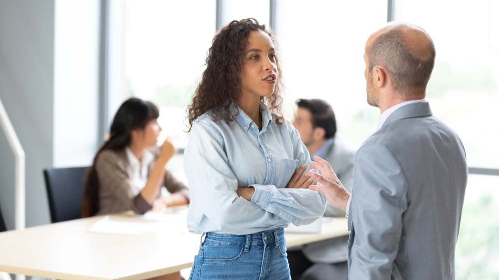 Arguing coworkers at meeting room