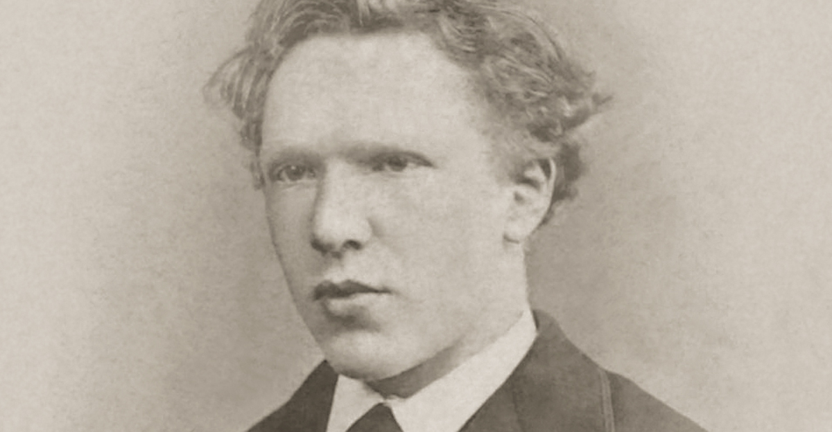 A black and white portrait of a young 19-year-old Vincent van Gogh