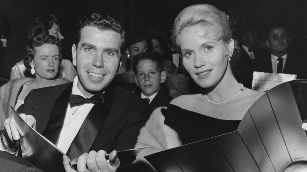 American actress Eva Marie Saint, wearing a black dress  and her husband
