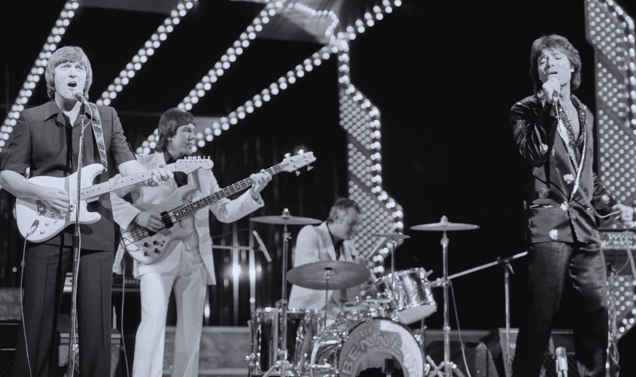 Gettyimages - 2229937845, Cliff Richard And The Shadows, 1981 Singer Cliff Richard, right, singing onstage during a Royal Variety performance with The Shadows' guitarist Bruce Welch, left, Theatre Royal, Drury Lane, London, November 23rd 1981.