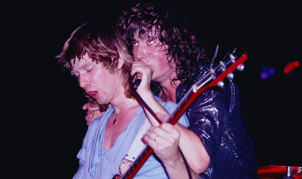  Gettyimages - 1746922824, Def Leppard Performs At Nassau Coliseum English Rock musicians Steve Clark (1960 - 1991) (left), on electric guitar, and singer Joe Elliott, both of the group Def Leppard, perform onstage at Nassau Coliseum (later Nassau Veterans Coliseum), Uniondale, New York, August 14, 1981. The group performed as an opening act (along with Scorpions) for headliner Ozzy Osbourne. 