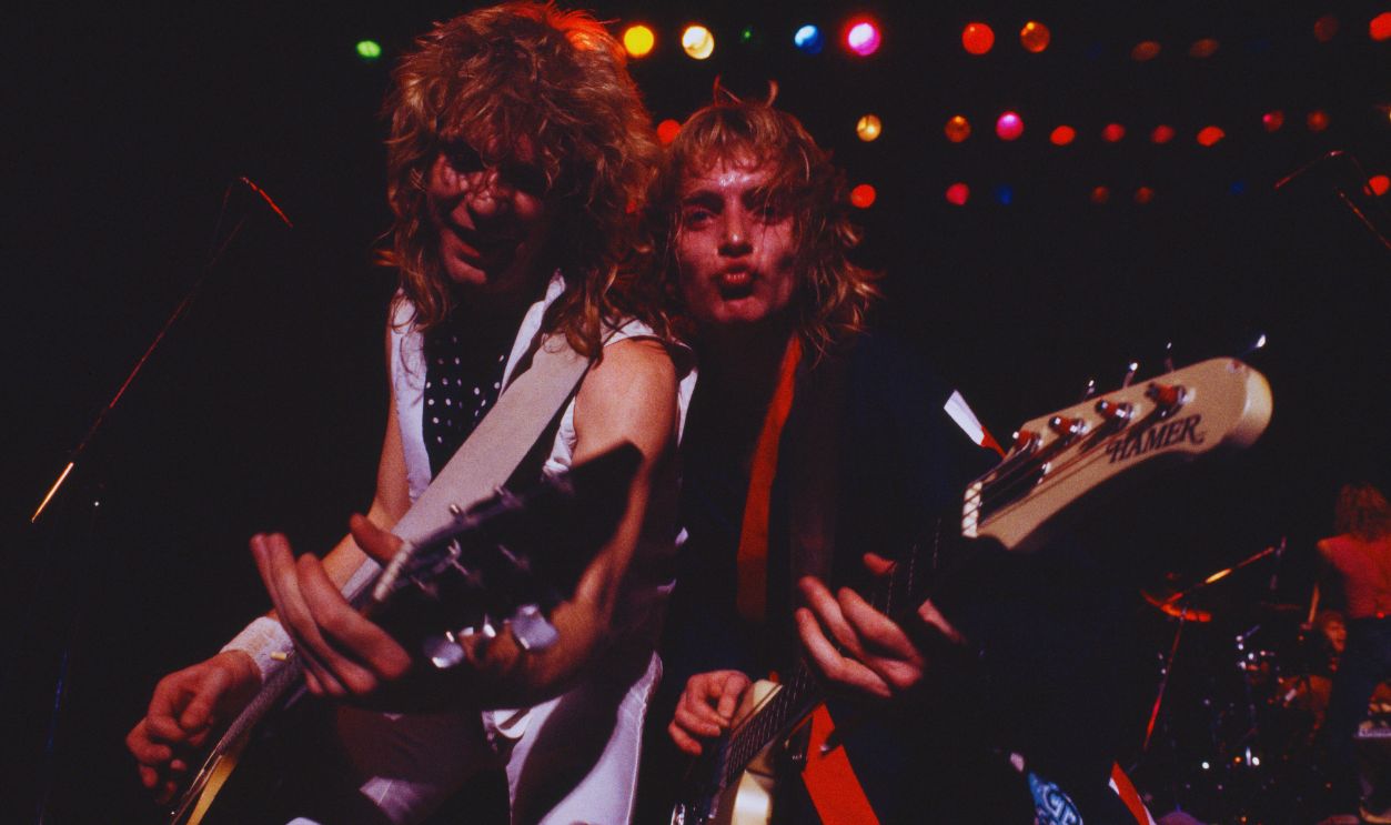 Gettyimages  - 1904488502, Def Leppard Performs In Tokyo (L-R) Steve Clark (guitar), Phil Collen (playing Hamer bass guitar) of Def Leppard perform at Shibuya Kokaido in Tokyo on their first Japanese tour, 24th January 1984.