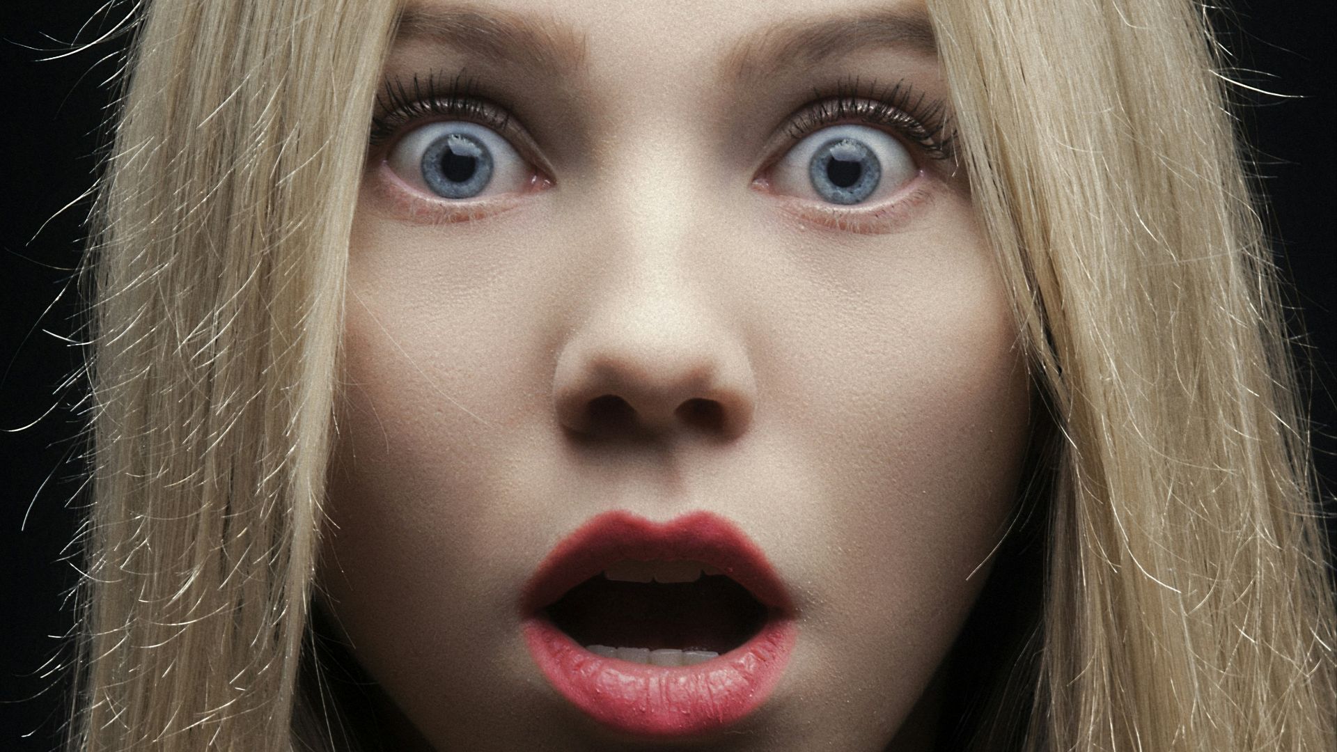 woman with blonde hair and red lipstick