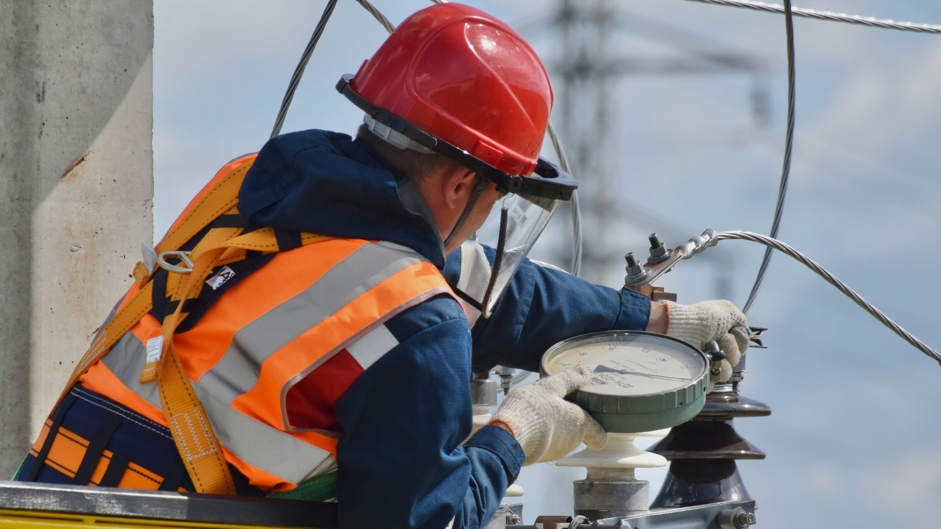 man in blue orange and white jacket wearing red helmet