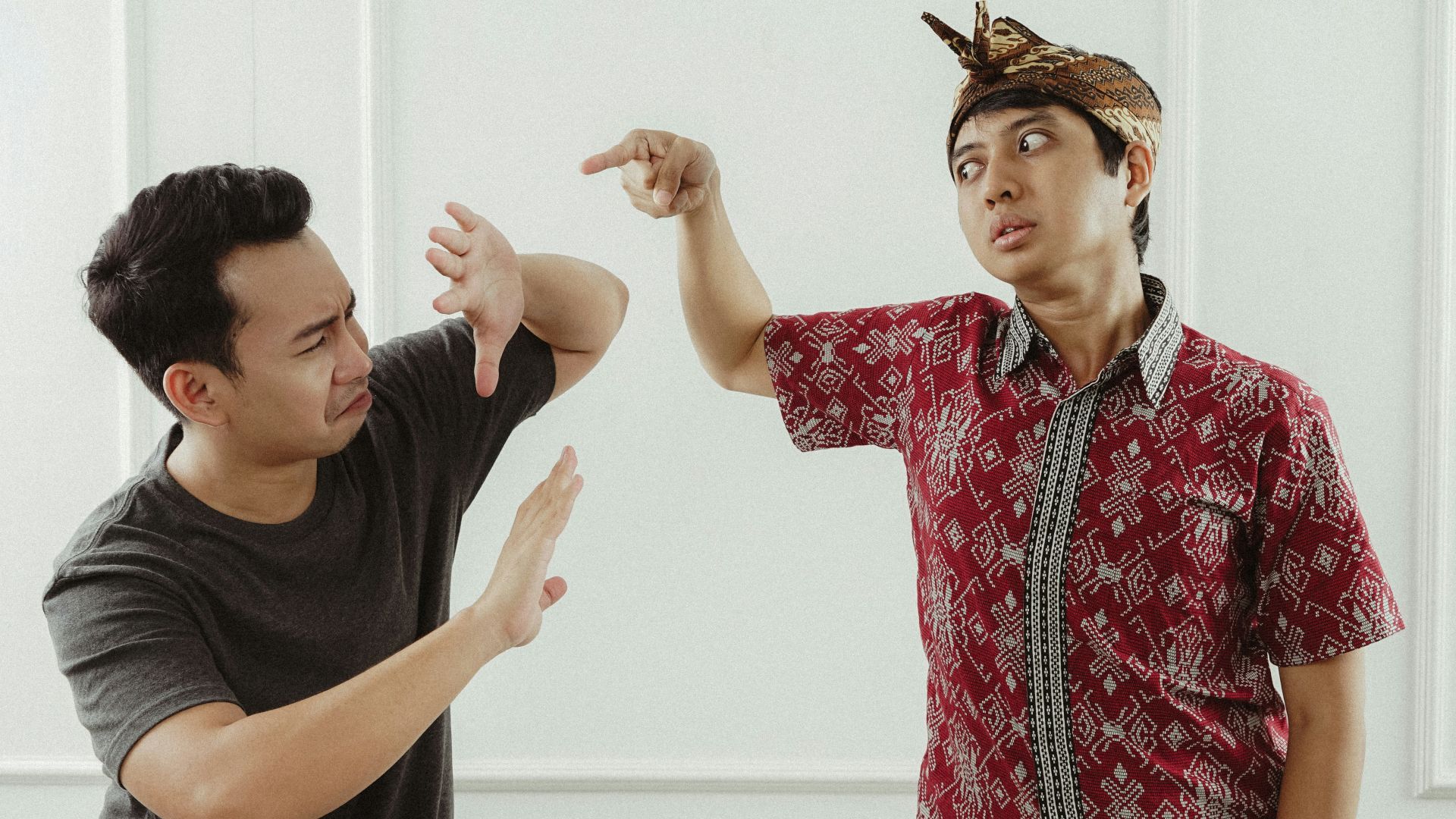 man in red and white button up shirt