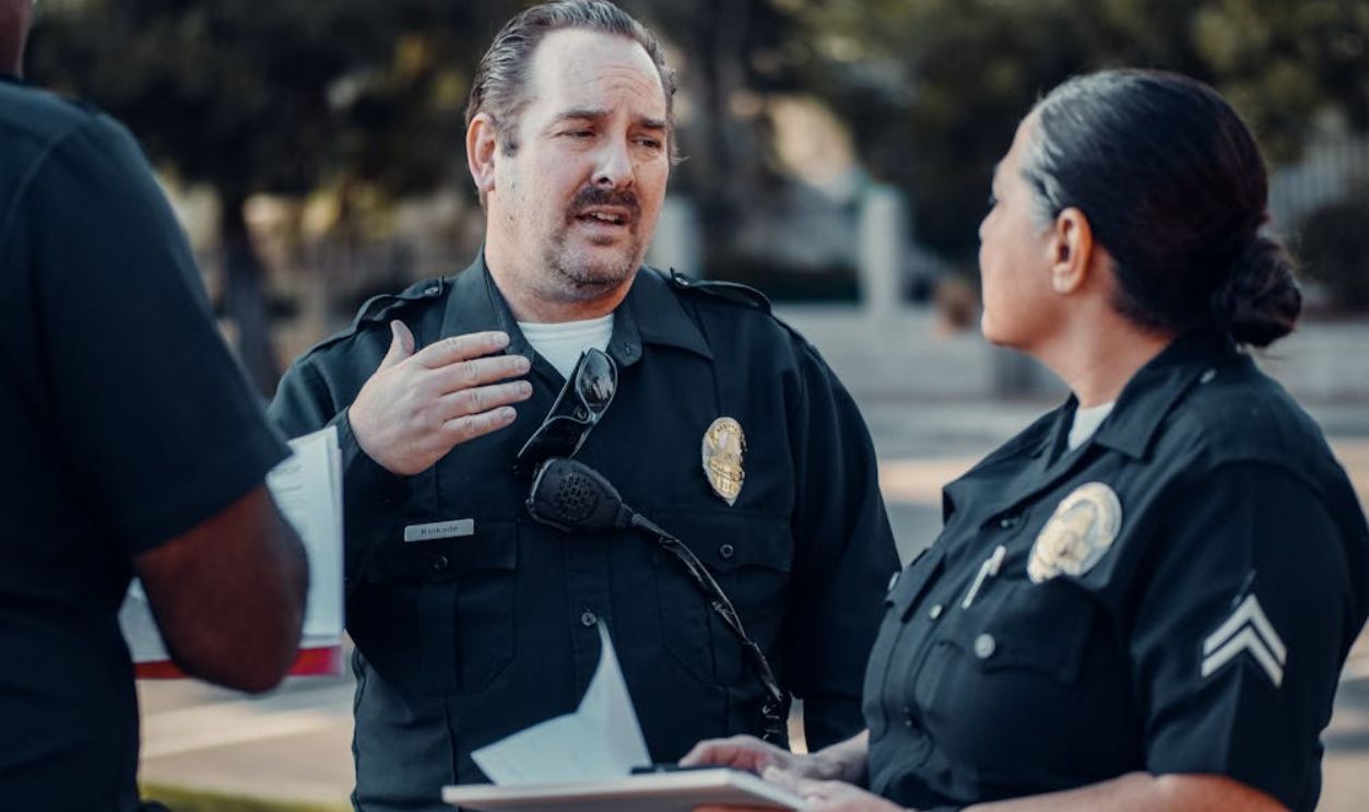 cops talking to a man