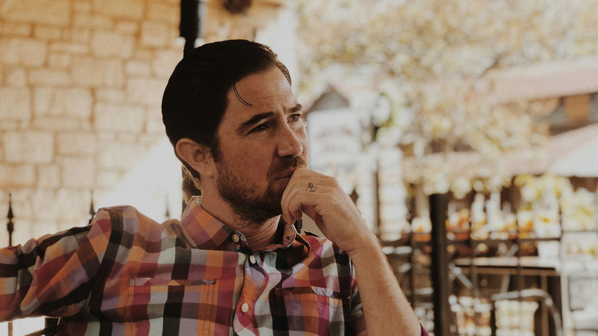 man in red and black plaid dress shirt