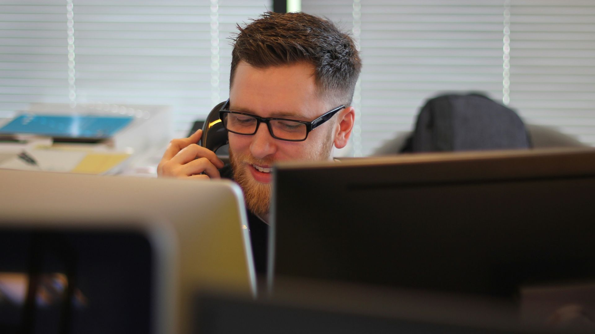 man using IP phone inside room