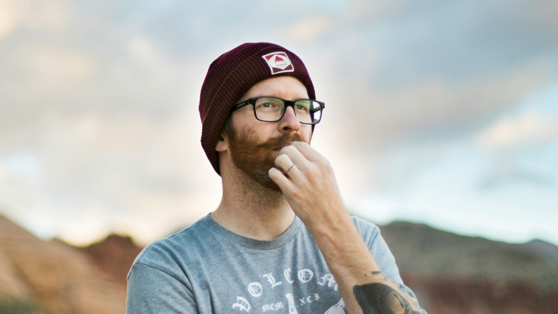 woman in blue crew neck t-shirt wearing black sunglasses