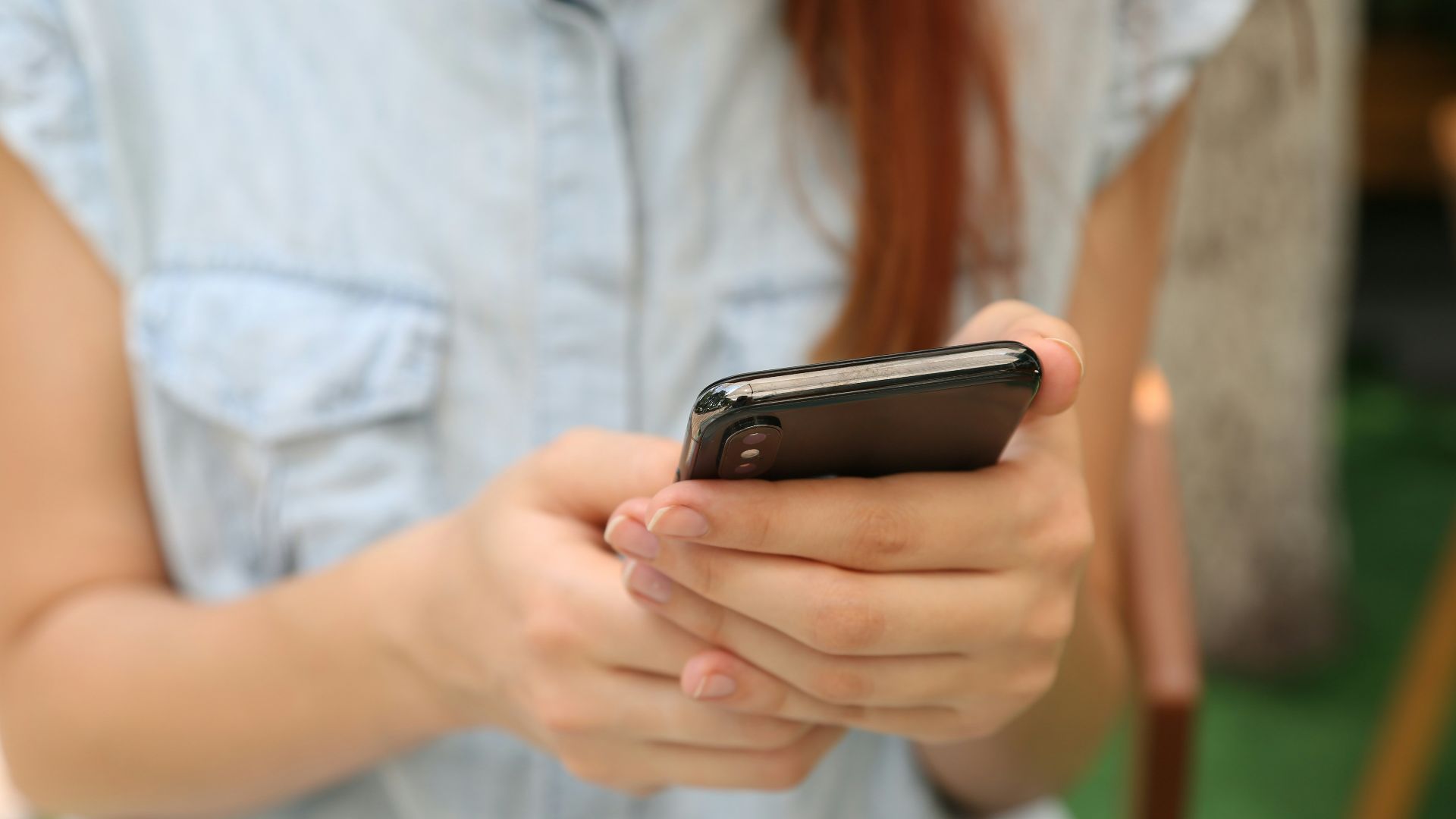 person holding using iPhone X