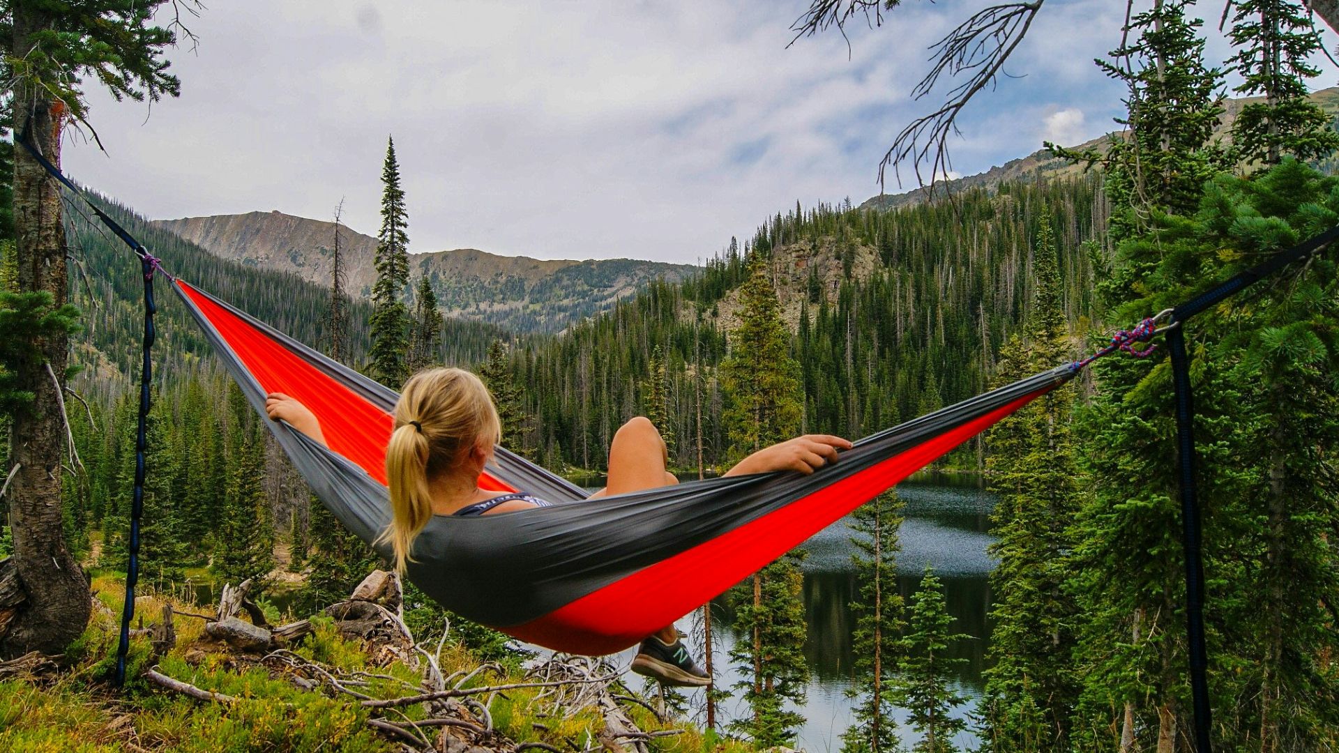 woman on hammock near to river