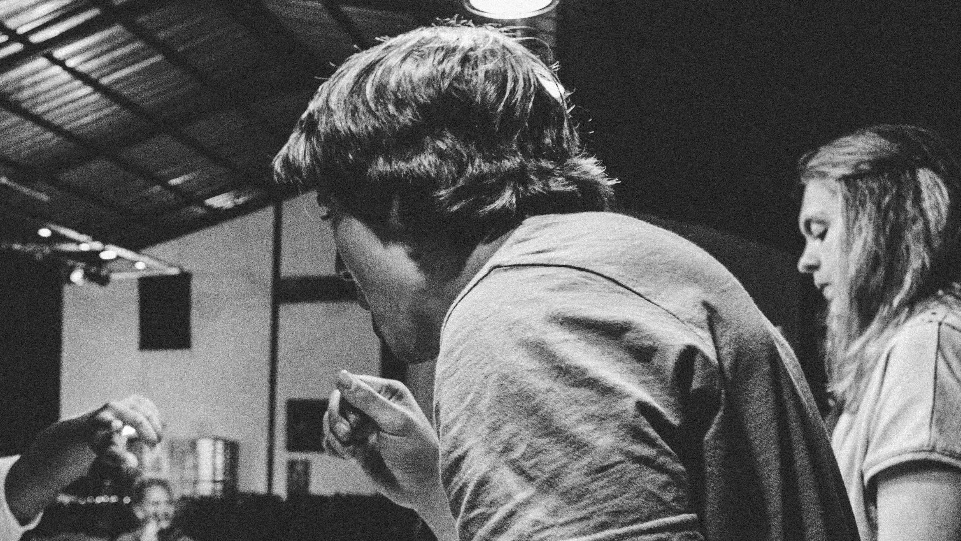 grayscale photography of people eating food