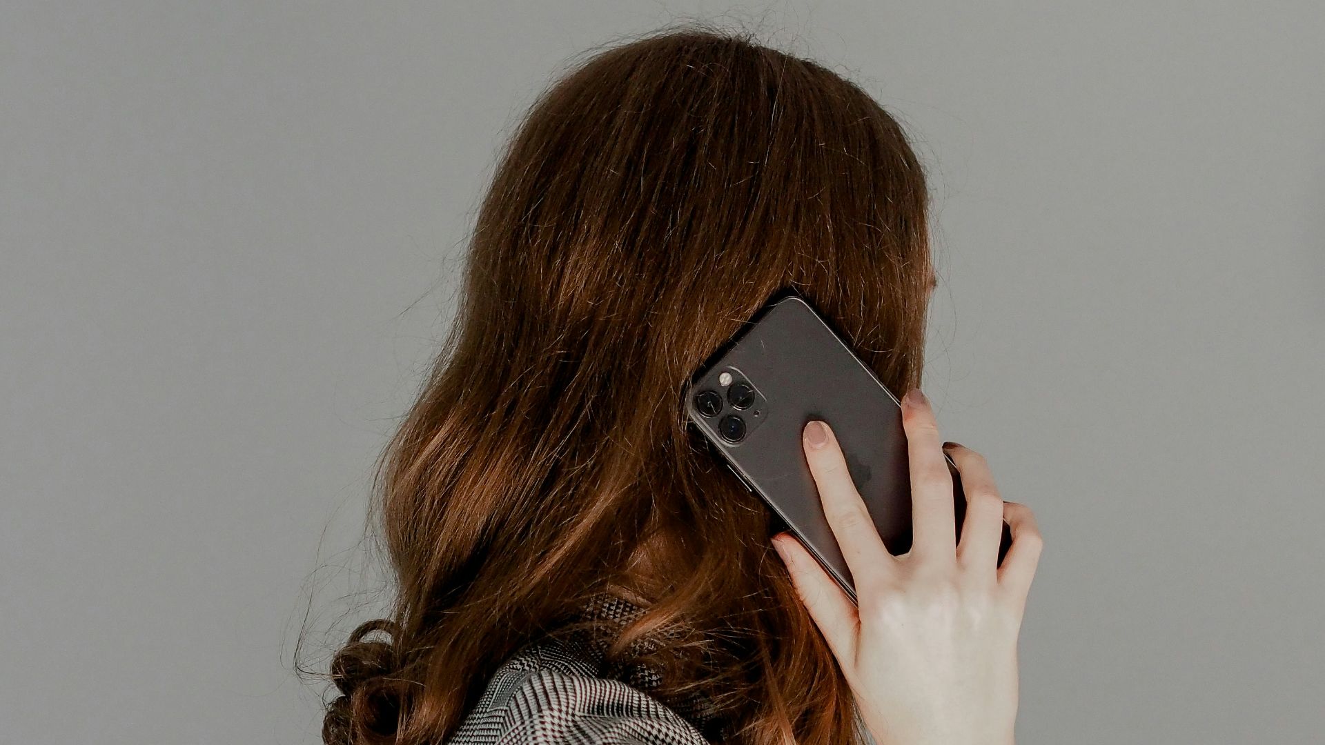 a woman holding a phone