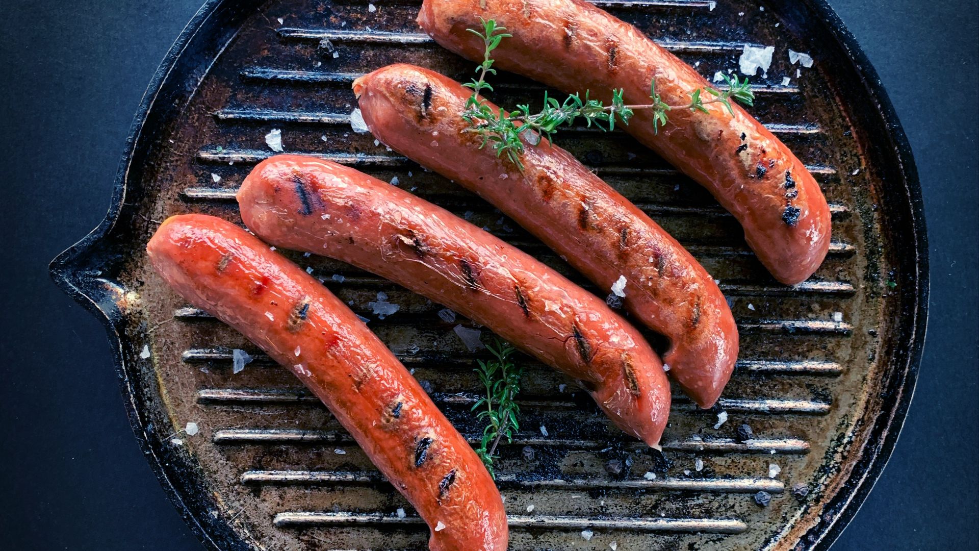sausage on black round pan