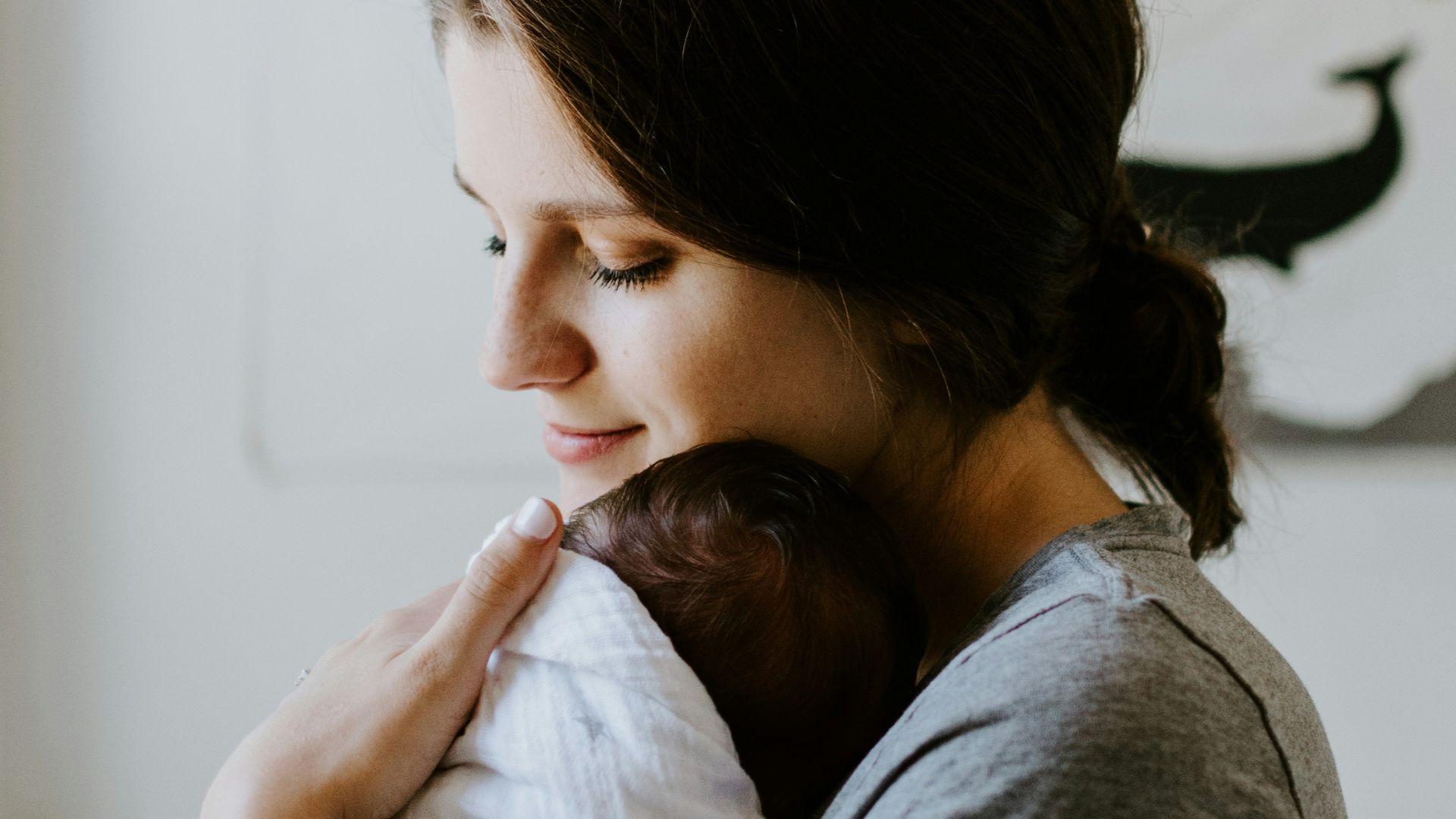 mother carrying baby
