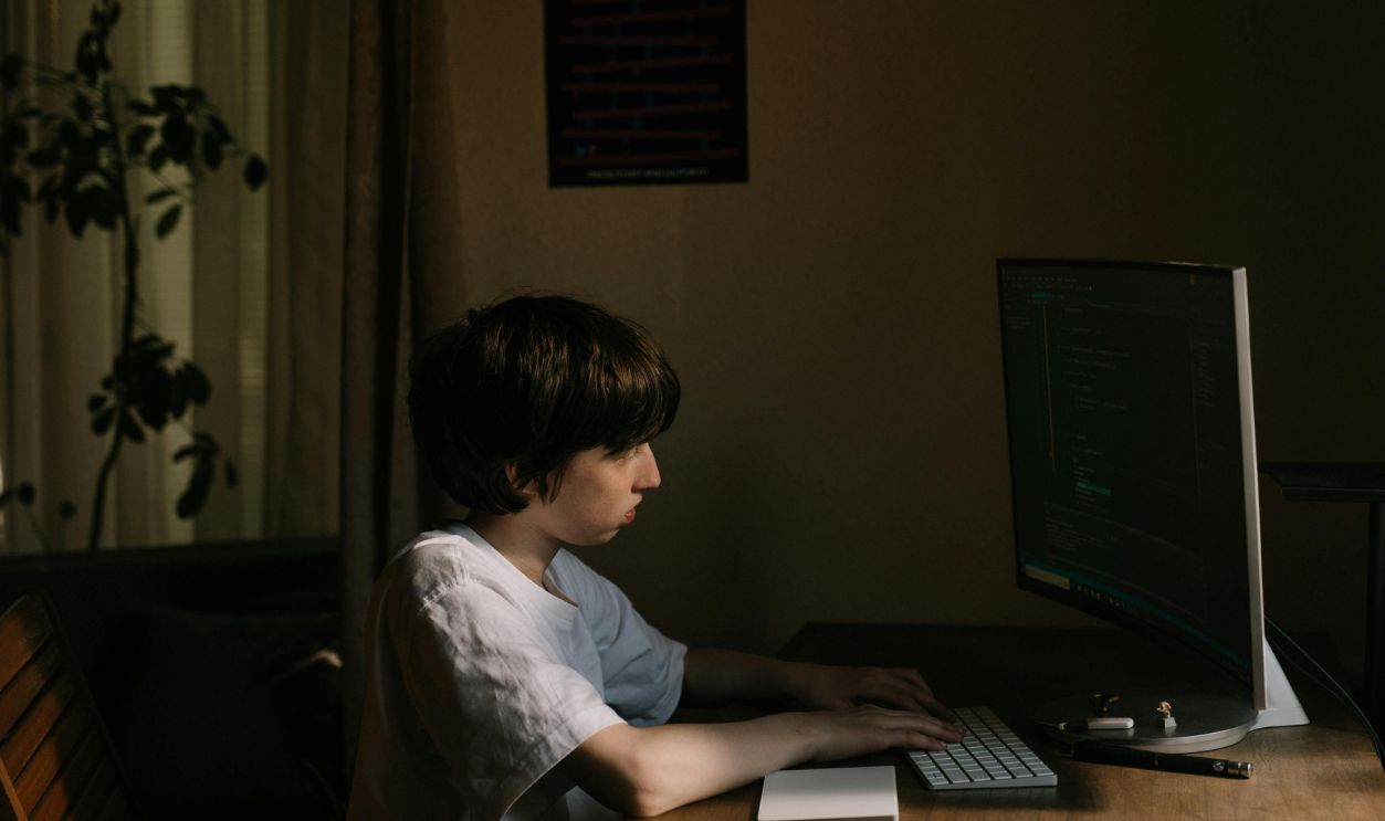 Boy in White T-shirt Using Laptop Computer