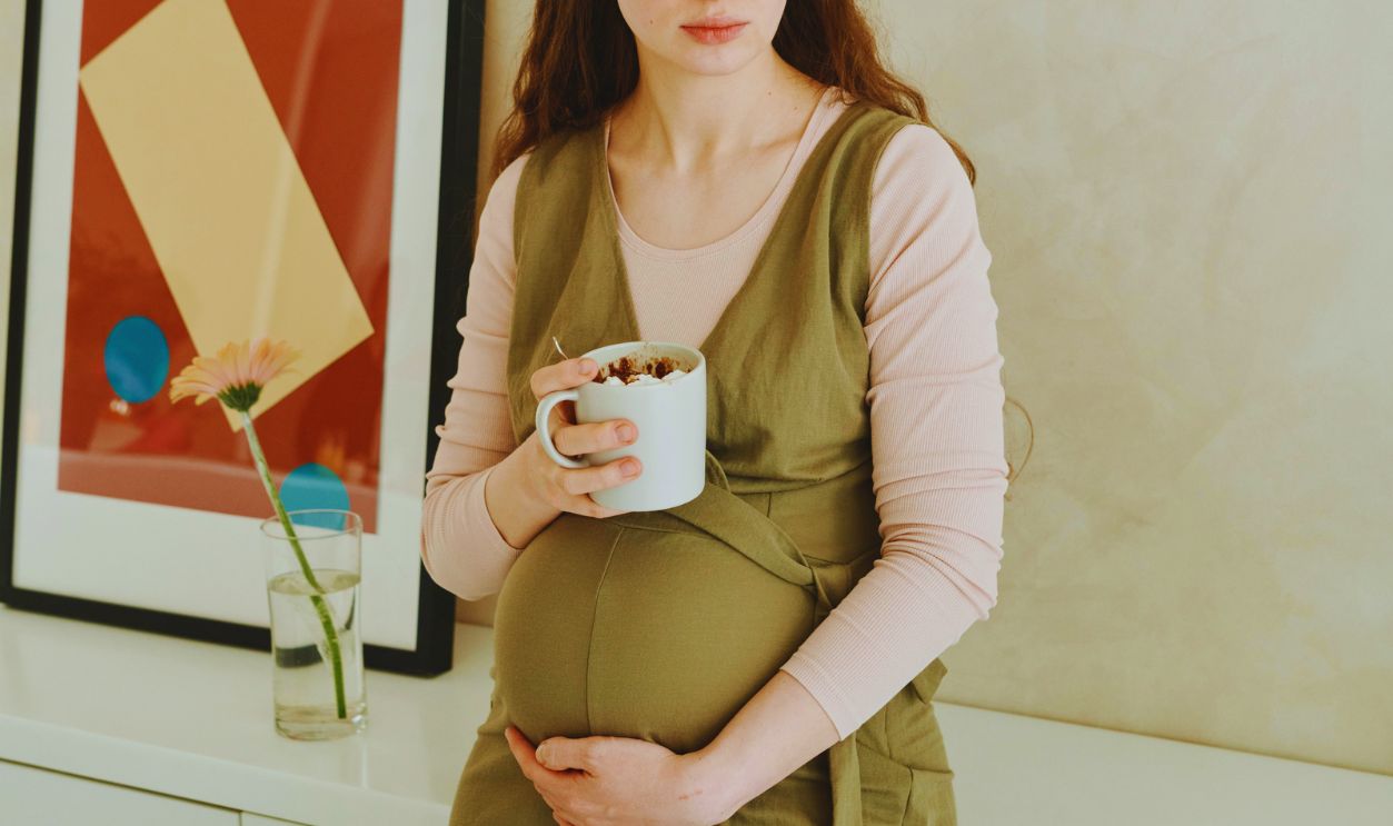 A Woman Holding a Cup