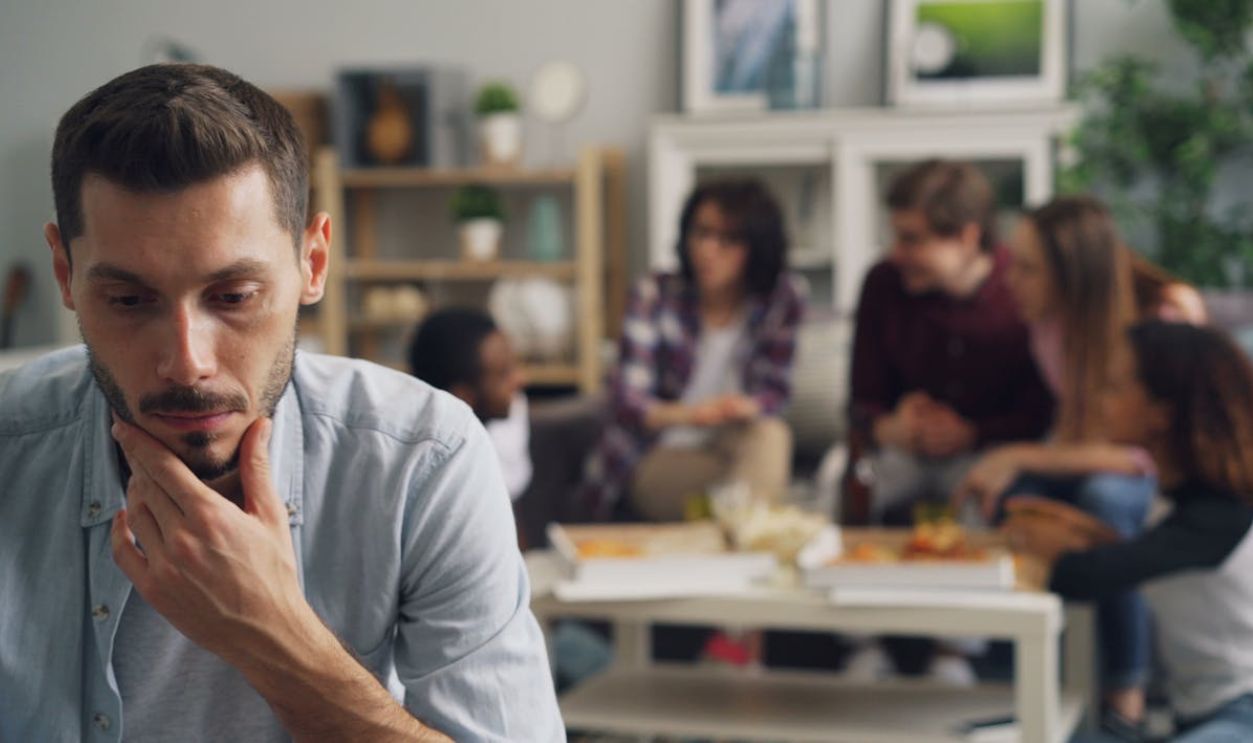 A man sitting in front of a group of people