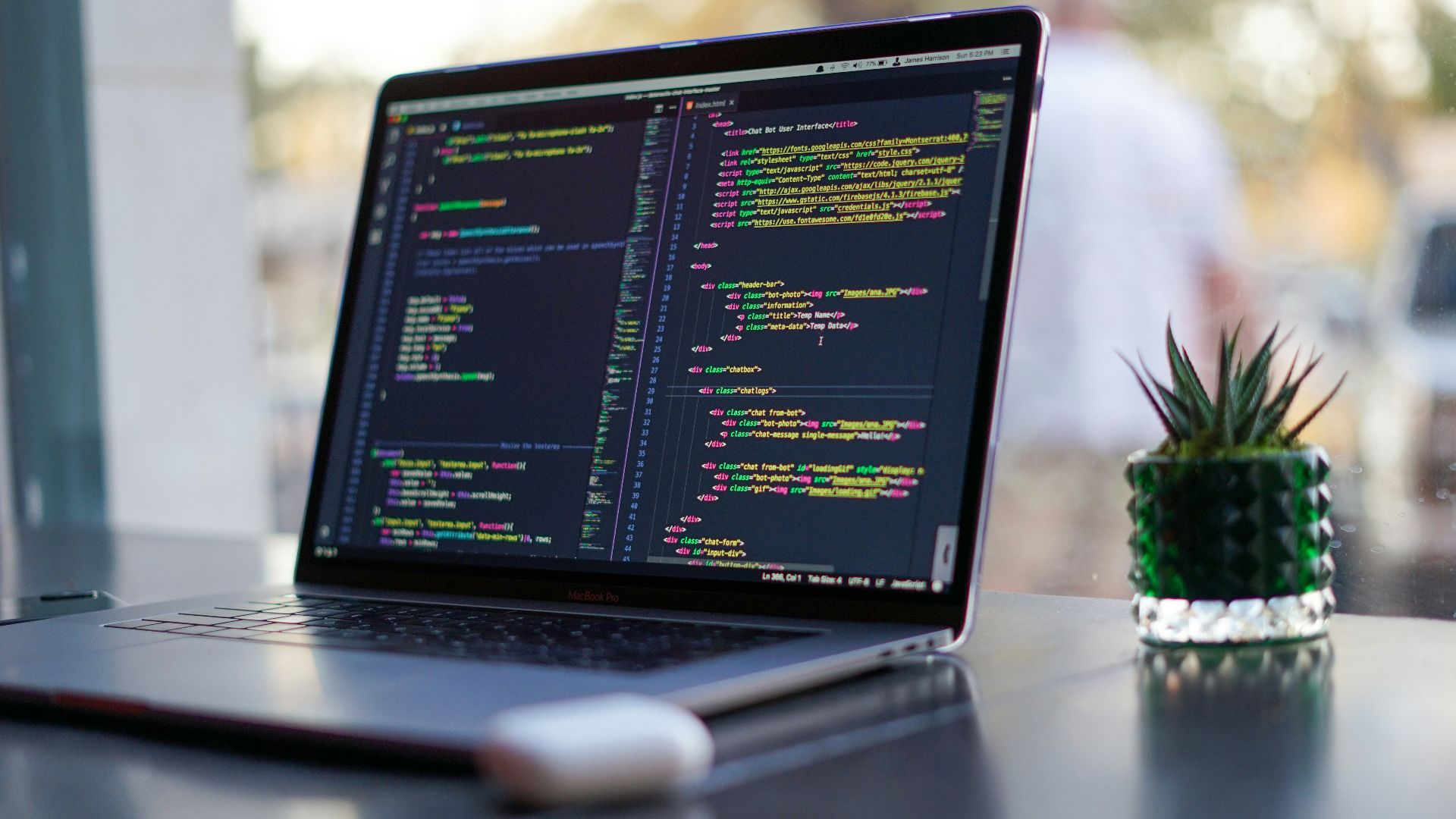 black laptop computer turned on on table