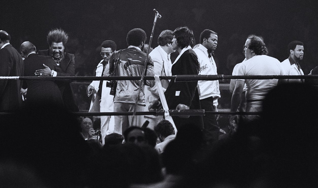 Gettyimages  - 141826600, Ali Vs. Evangelista American boxing promotor Don King (at left with large ring) embraces an unidentified man in the ring during a Heavyweight Championship